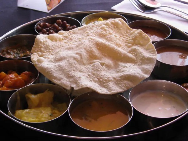 Chutney bowl beside a meal