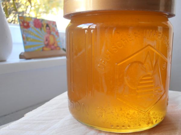 Honey jar on a breakfast table