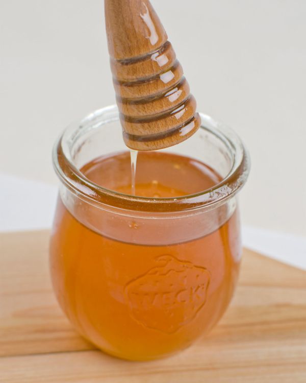 Honeycomb and honey spoon