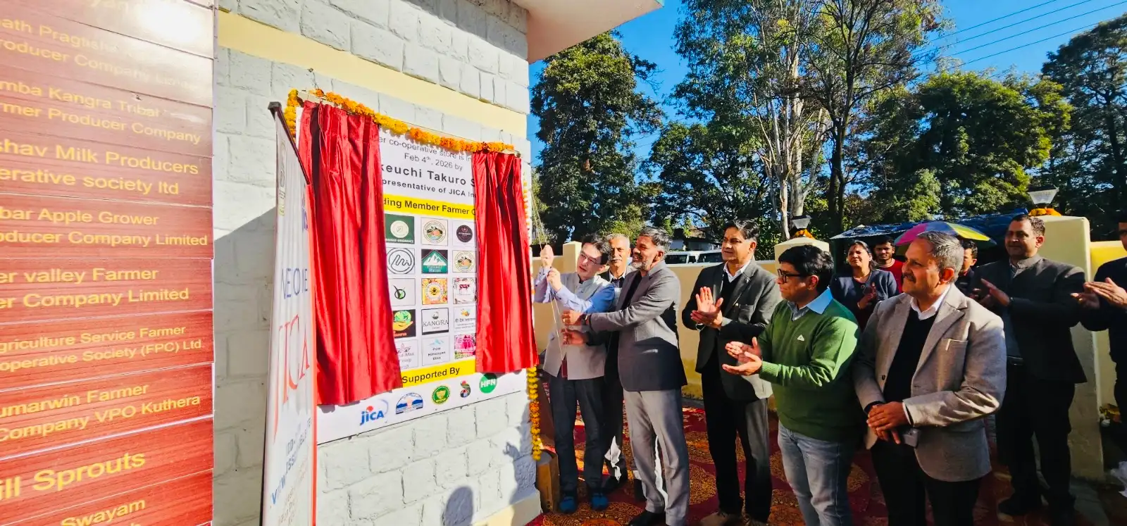 JICA, HPCDP and HFN representatives unveiling the HFN Store partnership board at Chetru, Dharamshala.